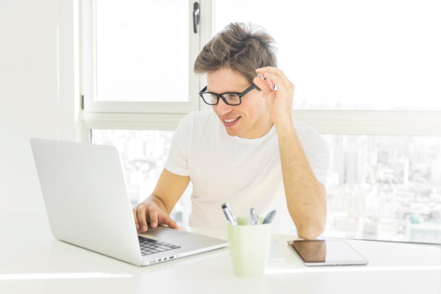 Hands working with calculator and financial planning documents on desk